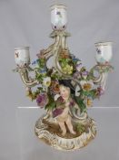 Three branch 19th century Meissen candelabra depicting hand painted  flowers with raised floral