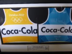 Two Olympic Vests in a glazed frame, one being a blue and white Coca Cola vest,  London 2012