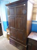 Antique oak panel single door cupboard supported on a deep base, approx. 94 x 55 x 179 cms.