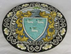 An Italian Maiolica charger possibly by Torquato Castellani dated 1843-1931 depicting a Coat of