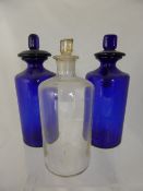 Eight misc. vintage apothecary bottles, three being blue and five being white.