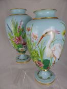 Pair of Victorian opaline glass vases depicting herons, the vase also having hand painted flowers,