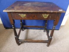 Antique oak hall table fitted with a single drawer on part turned legs united by stretchers,