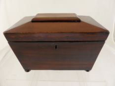 Victorian sarcophagus shaped rosewood tea caddy having two lidded compartments to the interior,