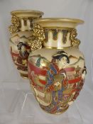 Pair of Satsuma vases having relief design depicting geisha with dogs of fo to the neck, approx. 31