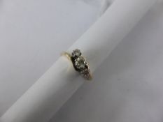 Lady`s 9ct Yellow and White Gold Three Stone Diamond Ring, centre diamond 16 pts, 2 x 6pts outside,