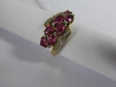 Lady`s 9ct Yellow Gold and Red Stone and Diamond Ring, the ring with central band set with two rows