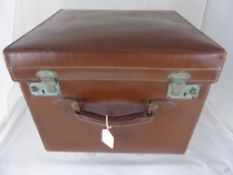 A Vintage Leather Hat Box with fitted silk lined interior.