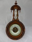 An Edwardian Oak Barometer.