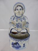 An Antique Delft Porcelain Novelty depicting a lady bathing her feet.