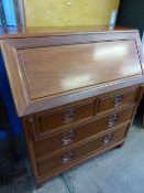 A cherry wood bureau, the interior fitted with pigeon holes and small drawers, the base having two