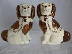 Pair of ceramic flat back figures of spaniels by Old Court Ware, Staffordshire, approx. 16 cms.