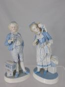 Two Continental Porcelain Figures depicting a girl with a kitten on her shoulder and a boy with his