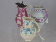 A Victorian Jug with raised white floral decoration on a pink ground with a hinged pewter lid and