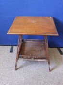 An Edwardian square mahogany occasional table having a galleried under shelf on splayed legs with