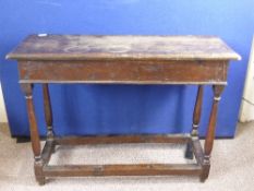 Antique oak side table on turned legs united by stretchers, approx. 98 x 34 x 74 cms.