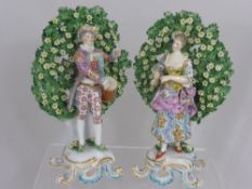 A pair of 19th Century Bocage Figures, in the Chelsea Derby style, depicting a Drummer boy and