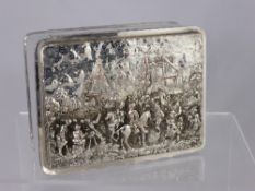 A Silver on Copper Cigarette Box with repousse lid depicting a medieval scene.