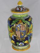 An Italian Earthenware Maiolica Lidded Jar painted with acanthus leaf and flowers and depicting a