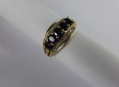 Lady`s 9ct Yellow Gold Diamond and Sapphire Ring, the ring set with five sapphires to the central