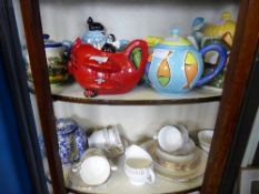 Collection of porcelain teapots including The Red Baron, Utterly Butterly butter dish, a blue seat,