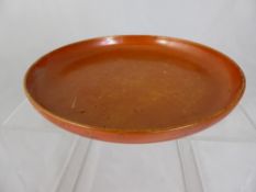 Ruskin orange lustre plate, impressed marks to the base, approx. 20 cms. diameter.