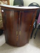 Georgian Bow Fronted Mahogany Corner Cupboard with brass key plates, 70 cms x 49 cms.