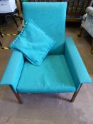 A pair of Parker Knoll armchairs, possibly 1960`s, covered in turquoise fabric.