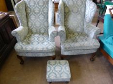 Pair of Victorian wing back armchairs covered in a floral velour fabric with a blue grey ground on