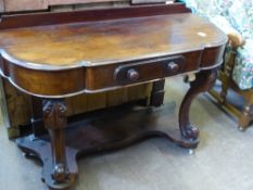 Victorian mahogany duchess wash stand having ornate carved front legs supported on an under shelf