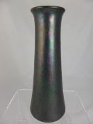 Ruskin dark blue lustre vase, the vase having several colours including purple, green etc.