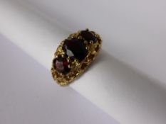 Lady`s White Gold Baroque Style Three Stone Garnet Ring, Size L, approx 3.5 gms.