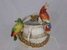 Continental porcelain vase in the form of a basket with applied roses and green and red cockatoos