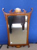 Edwardian inlaid mahogany framed wall mirror having scrolled decoration to top and bottom with a