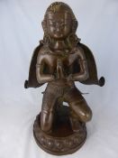 A bronze figure of ?Garuda?, the vehicle of  ?Vishnu?, half man and half bird depicted genuflecting