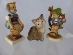 Two West German Hummel Figures together with a Beswick figure of a kitten.