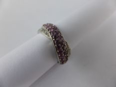 A Lady`s 375 stamped White Gold Pink Stone Ring.