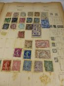 An album containing an all-world collection of stamps, almost exclusively pre-1914.