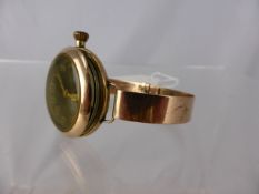 A gentleman`s 9ct gold cased wristwatch on a gold plated band, the watch having a black face with