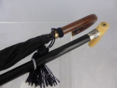 Ebony Walking Cane, with a ivorine silver collared handle, Chester hallmark, m.m WHR together with