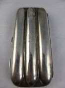 A solid silver cigar case, moulded to accommodate three cigars, Birmingham hallmarked, mm  W H L,