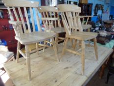 Four pine kitchen chairs on turned legs with splat backs ( two being carvers )