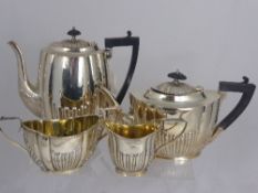 A Silver Plated Fluted Design Tea Set, comprising tea pot, hot water pot, sugar bowl and milk jug.