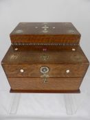 An Oak Sewing Box inlaid with various coins and Mother of Pearl decoration with sewing contents.