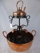 A Copper Jam Kettle together with a Copper Art Nouveau style kettle and stand.