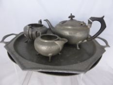 A Vintage Pewter Tea Service, Tray, Teapot, Milk Jug, and Sugar Bowl together with a charger and
