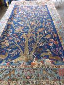 An antique very fine Middle Eastern carpet depicting the tree of life, the carpet having a cobalt