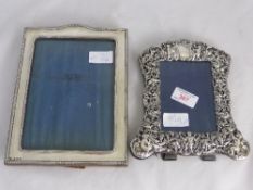 A solid silver photo frame, Birmingham hallmark, dated 1921, mm B P D C together with another solid