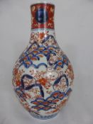 An Antique Chinese Imari Bottle Vase, the vase painted with floral design with full flowering