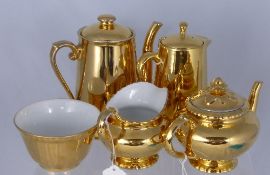 A Royal Worcester Gold Lustre Tea Trio comprising Tea Pot, Coffee Pot, Hot Water Pot, Milk Jug and